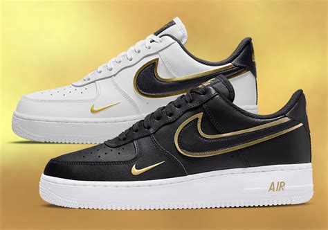 white nikes with gold swoosh